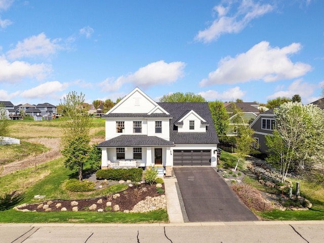 343 Primrose Path, Bayport, MN 55003 - view of front facade with covered porch, asphalt driveway, a garage, a residential view, and roof with shingles