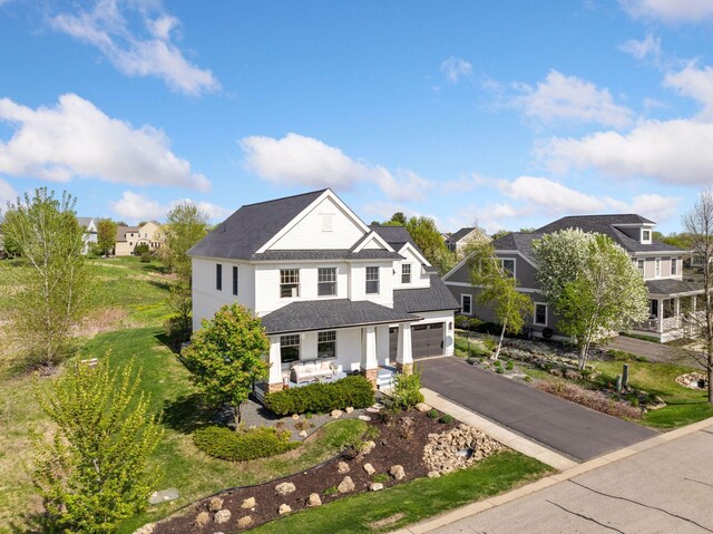 343 Primrose Path, Bayport, MN 55003 - view of front of house with asphalt driveway, a garage, and a residential view