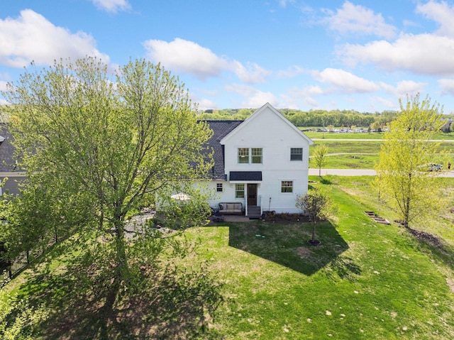343 Primrose Path, Bayport, MN 55003 - rear view of property featuring a lawn and roof with shingles