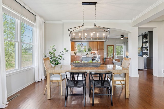 343 Primrose Path, Bayport, MN 55003 - dining room with dark wood-type flooring, baseboards, a ceiling fan, and ornamental molding
