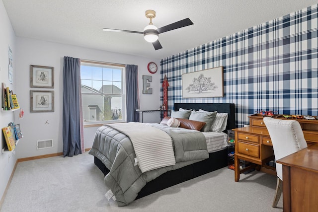 343 Primrose Path, Bayport, MN 55003 - bedroom with carpet, a textured ceiling, a ceiling fan, baseboards, and wallpapered walls