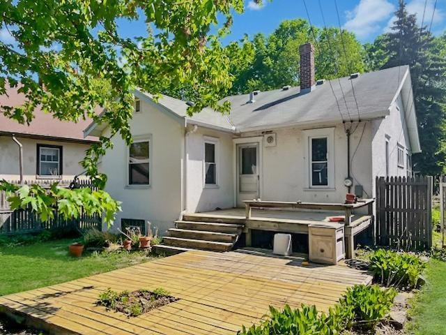 2748 41st Ave S, Minneapolis, MN 55406 - rear view of house featuring a deck, stucco siding, and a chimney