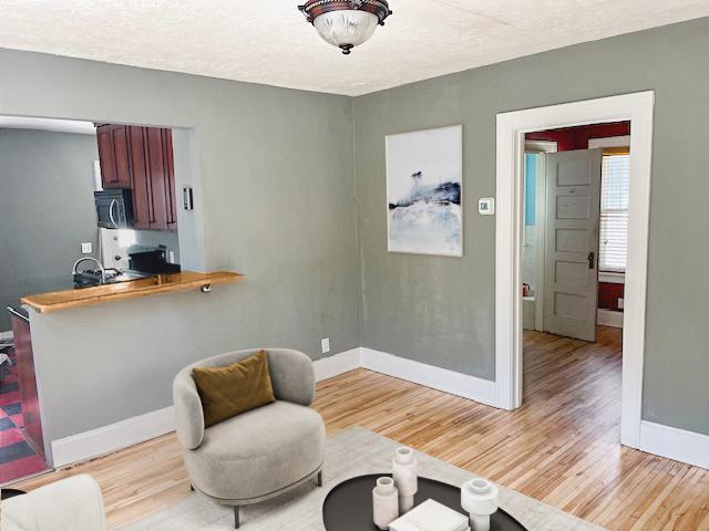 2748 41st Ave S, Minneapolis, MN 55406 - living area with light wood finished floors and baseboards