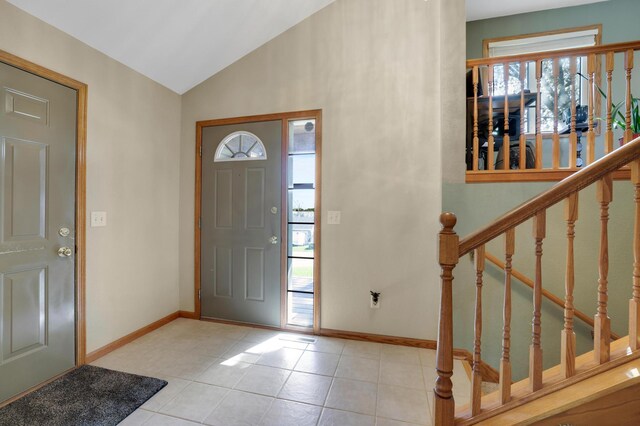 4954 Jeffers Ct, Lonsdale, MN 55046 - tiled entrance foyer with plenty of natural light, vaulted ceiling, baseboards, and stairway
