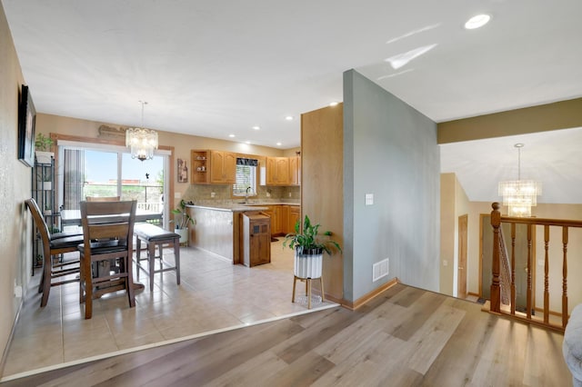 4954 Jeffers Ct, Lonsdale, MN 55046 - dining room featuring a chandelier, recessed lighting, and light wood-style flooring