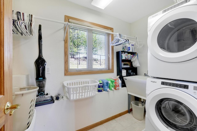 4954 Jeffers Ct, Lonsdale, MN 55046 - washroom featuring stacked washer / drying machine, light tile patterned flooring, and baseboards