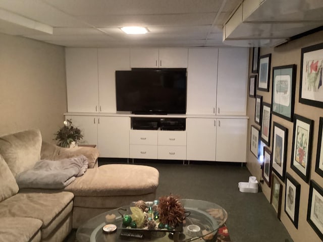 living room featuring a paneled ceiling