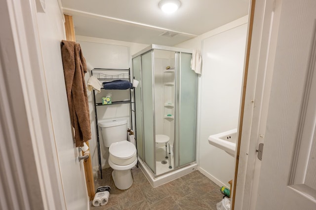 4448 43rd Ave S, Minneapolis, MN 55406 - bathroom featuring toilet, a shower stall, and baseboards