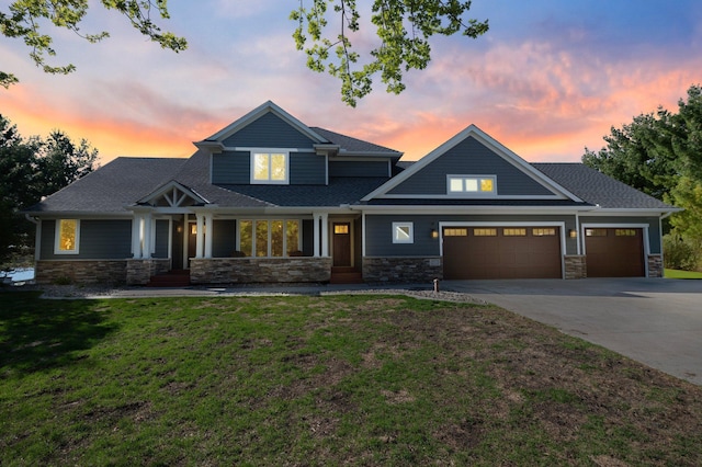 19776 214th Ave NW, Big Lake Twp, MN 55309 - craftsman house with stone siding, an attached garage, a lawn, driveway, and a shingled roof