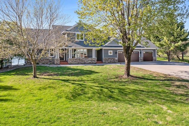 19776 214th Ave NW, Big Lake Twp, MN 55309 - craftsman house featuring stone siding, concrete driveway, an attached garage, and a front yard