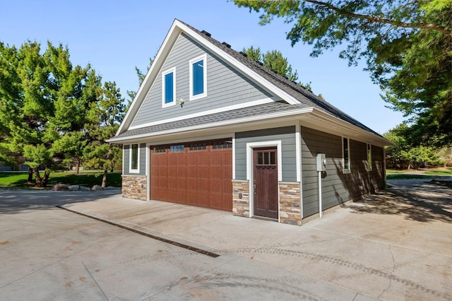 19776 214th Ave NW, Big Lake Twp, MN 55309 - view of front of home featuring a detached garage and stone siding