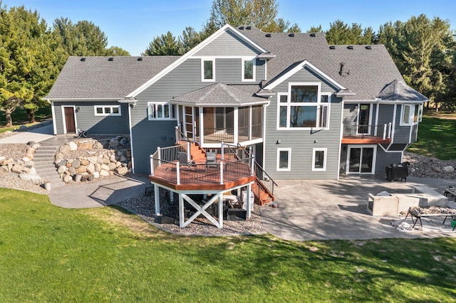 19776 214th Ave NW, Big Lake Twp, MN 55309 - back of property with stairway, a patio, a deck, a lawn, and a shingled roof