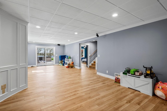 19776 214th Ave NW, Big Lake Twp, MN 55309 - rec room with light wood-type flooring, crown molding, recessed lighting, a drop ceiling, and baseboards