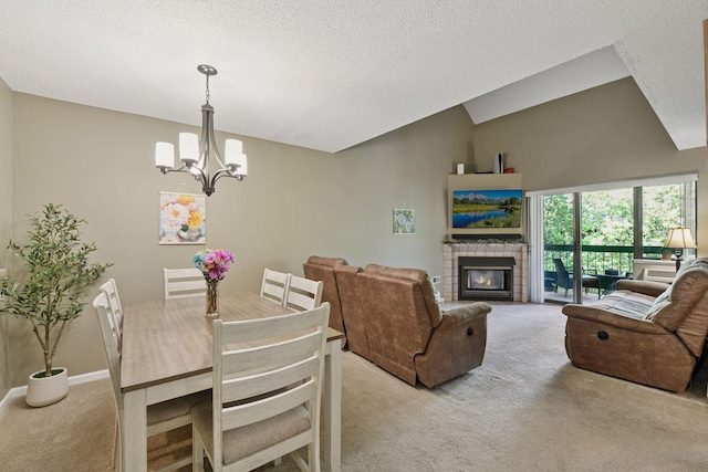 7618 York Ave S Unit 1318, Edina, MN 55435 - dining space with light carpet, a chandelier, a textured ceiling, a fireplace, and lofted ceiling