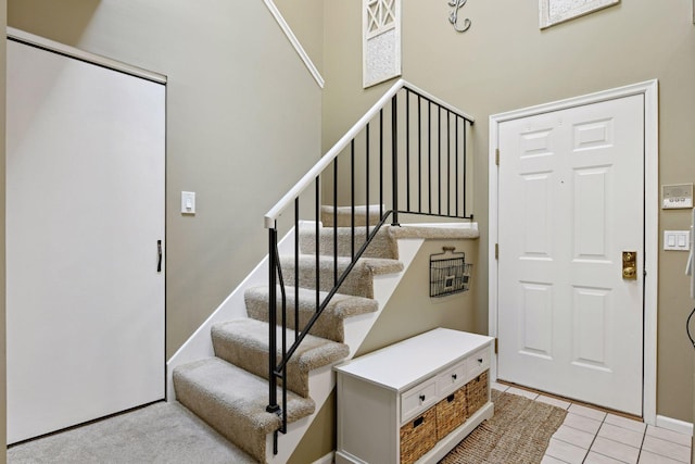 7618 York Ave S Unit 1318, Edina, MN 55435 - foyer featuring stairway, a towering ceiling, and light tile patterned floors
