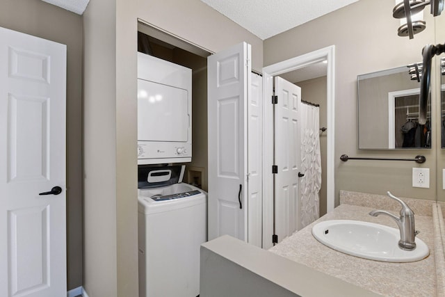 7618 York Ave S Unit 1318, Edina, MN 55435 - bathroom with stacked washer / dryer, a textured ceiling, and vanity