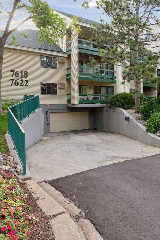 7618 York Ave S Unit 1318, Edina, MN 55435 - view of property featuring an attached garage and driveway