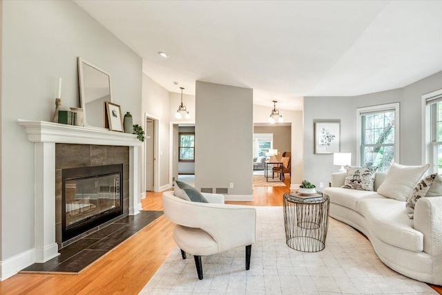 14716 Oak Run Ln, Burnsville, MN 55306 - living room with wood finished floors, a fireplace, and recessed lighting