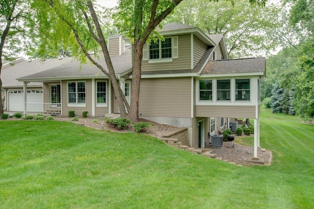 14716 Oak Run Ln, Burnsville, MN 55306 - view of front facade with a front yard, a chimney, and roof with shingles