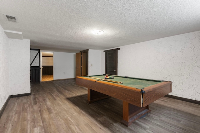 recreation room with baseboards, wood finished floors, a textured ceiling, billiards table, and a textured wall