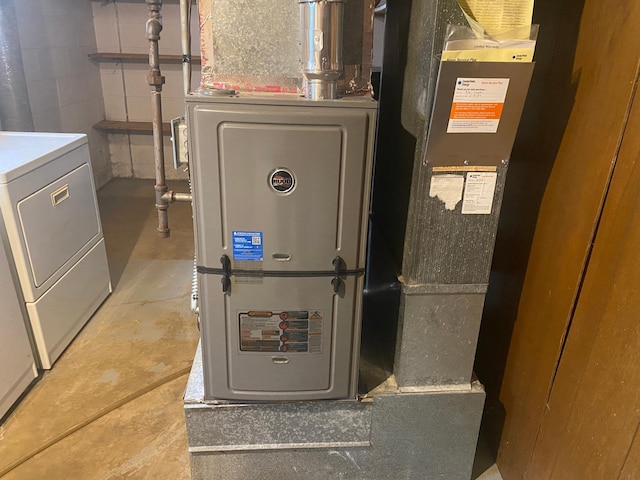utilities featuring washer / clothes dryer and heating unit