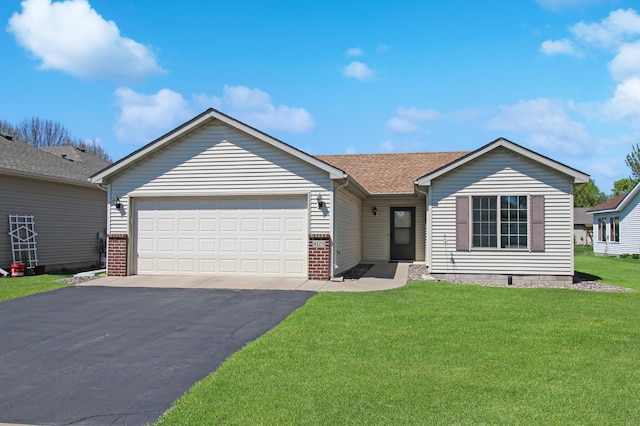 4129 6th St S, Saint Cloud, MN 56301 - ranch-style house with asphalt driveway, a garage, a front yard, a shingled roof, and brick siding