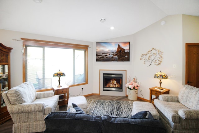 4129 6th St S, Saint Cloud, MN 56301 - living room with wood finished floors, vaulted ceiling, a glass covered fireplace, and baseboards