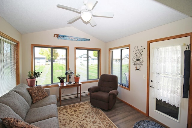 4129 6th St S, Saint Cloud, MN 56301 - living room featuring a baseboard heating unit, wood finished floors, lofted ceiling, a ceiling fan, and baseboards