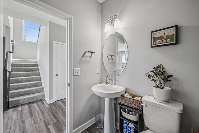 104 Hummingbird Way, Delano, MN 55328 - bathroom with wood finished floors and toilet