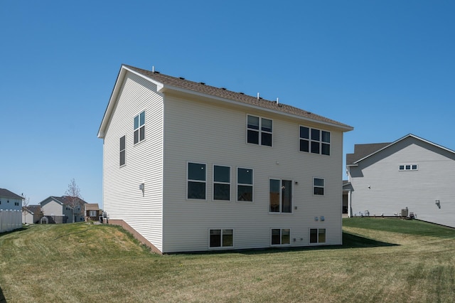 104 Hummingbird Way, Delano, MN 55328 - rear view of property with a yard