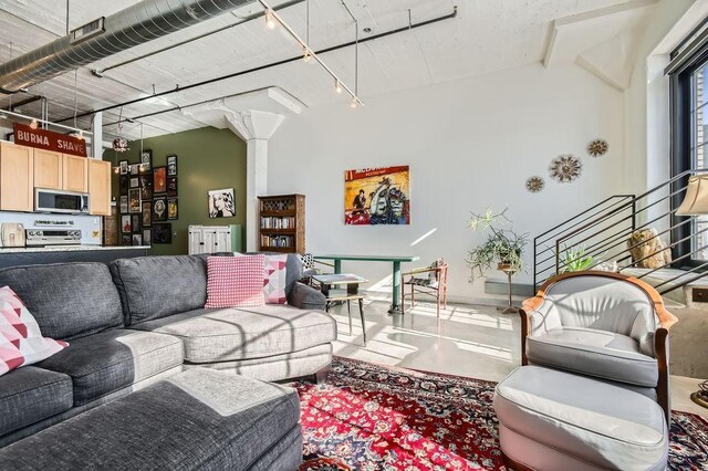 730 Stinson Blvd Unit 205, Minneapolis, MN 55413 - living area featuring finished concrete flooring and track lighting