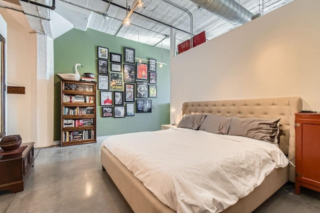 730 Stinson Blvd Unit 205, Minneapolis, MN 55413 - bedroom featuring finished concrete floors and a towering ceiling