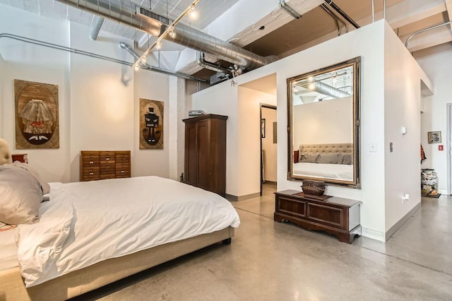 730 Stinson Blvd Unit 205, Minneapolis, MN 55413 - bedroom with concrete flooring and baseboards