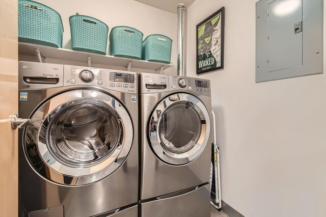 730 Stinson Blvd Unit 205, Minneapolis, MN 55413 - clothes washing area featuring electric panel and washer and dryer