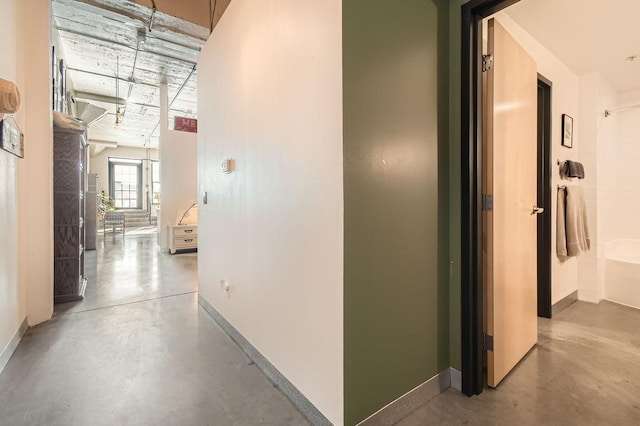 730 Stinson Blvd Unit 205, Minneapolis, MN 55413 - hall featuring finished concrete flooring and baseboards