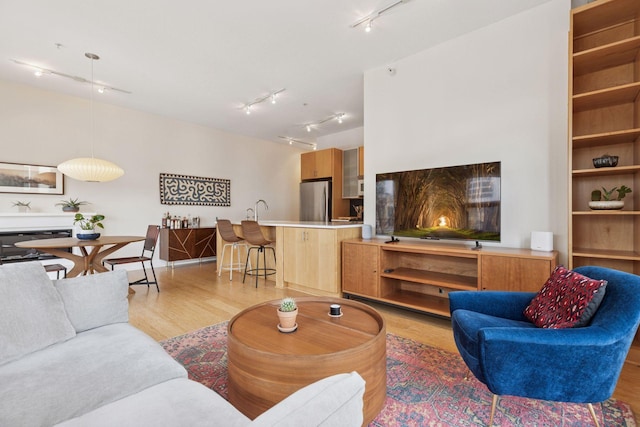 2845 Colfax Ave S Unit W202, Minneapolis, MN 55408 - living room with rail lighting and light wood finished floors