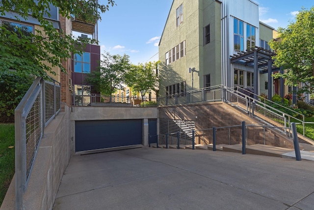 2845 Colfax Ave S Unit W202, Minneapolis, MN 55408 - view of building exterior featuring a garage