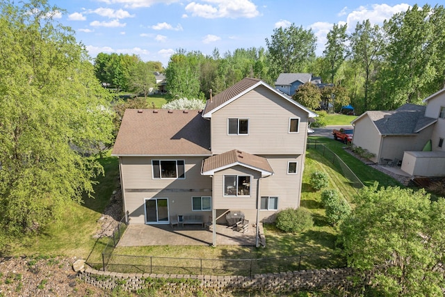 rear view of property featuring a patio area