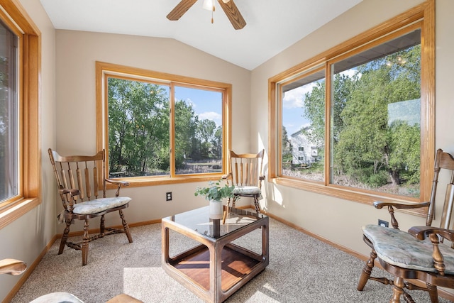 sunroom with healthy amount of natural light and lofted ceiling