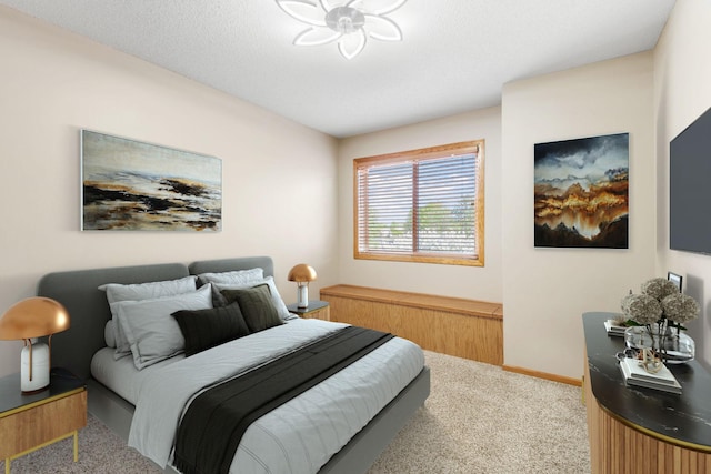 bedroom featuring carpet flooring and baseboards