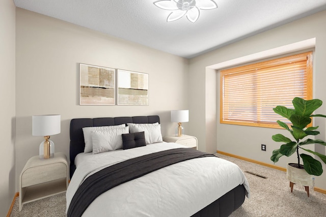 carpeted bedroom with baseboards