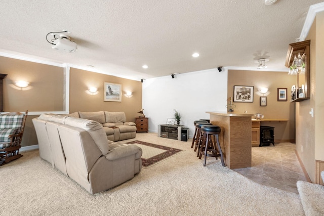 home theater room featuring ornamental molding, a textured ceiling, light carpet, recessed lighting, and a wood stove