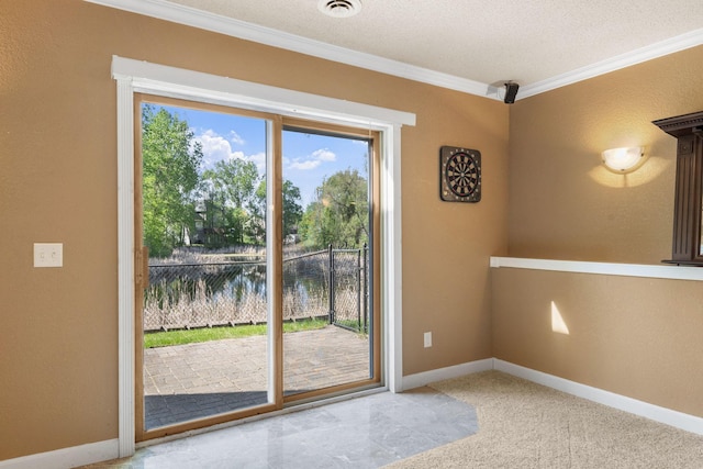 entryway with crown molding, baseboards, a water view, and carpet flooring