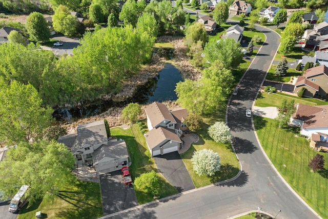 aerial overview of property's location with nearby suburban area and a large body of water