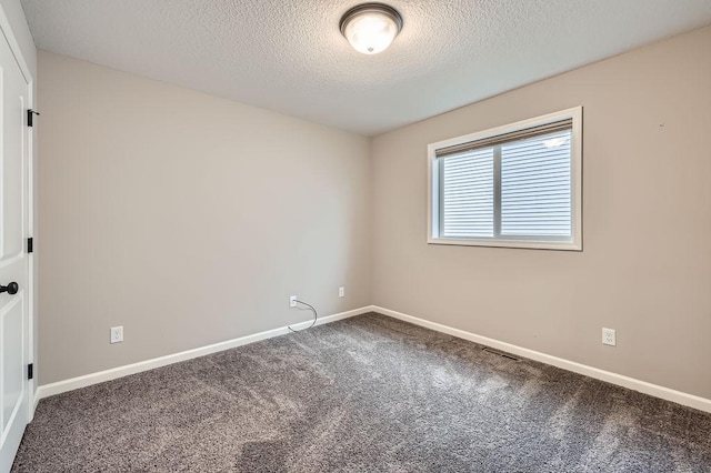 6168 Quenroe Ave NE, Otsego, MN 55330 - carpeted spare room with a textured ceiling and baseboards