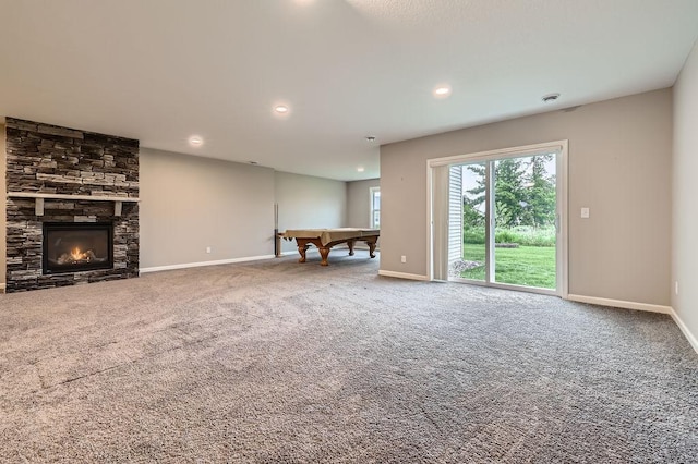 6168 Quenroe Ave NE, Otsego, MN 55330 - unfurnished living room featuring pool table, carpet flooring, recessed lighting, and a stone fireplace