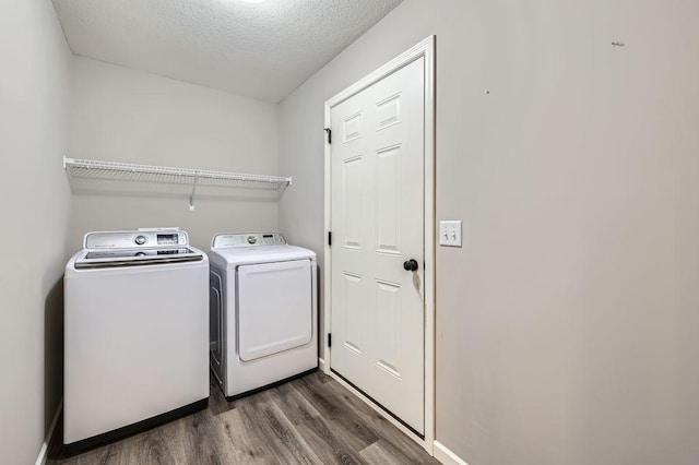 6168 Quenroe Ave NE, Otsego, MN 55330 - laundry area with dark wood finished floors, separate washer and dryer, and a textured ceiling