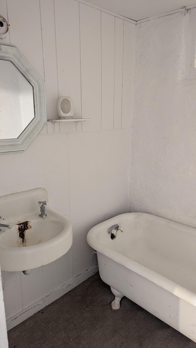 1211 10th Ave SW, Austin, MN 55912 - bathroom with a freestanding bath and a sink