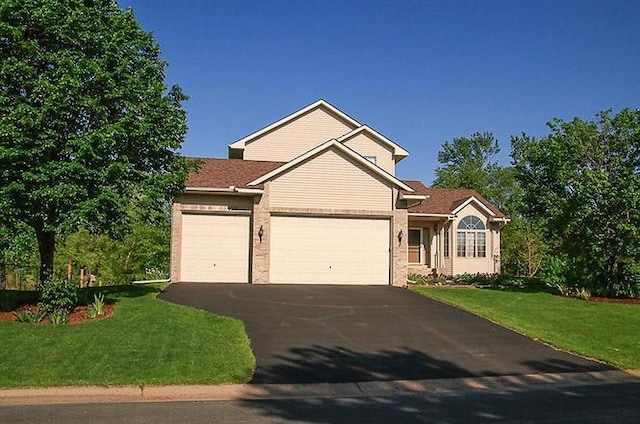 2607 226th Ln NW, Oak Grove, MN 55005 - view of front of house with driveway, a garage, and a front yard