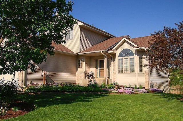 2607 226th Ln NW, Oak Grove, MN 55005 - view of front of house featuring a front yard, an attached garage, and central AC unit